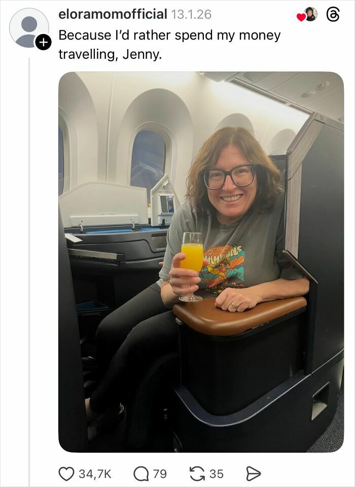 Woman smiling in airplane seat holding a glass of orange juice, sharing savage replies to girls not getting nails done.