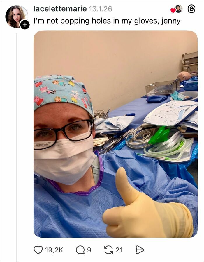 Female healthcare worker in surgical gloves and mask giving thumbs up, highlighting why girls don’t get their nails done.