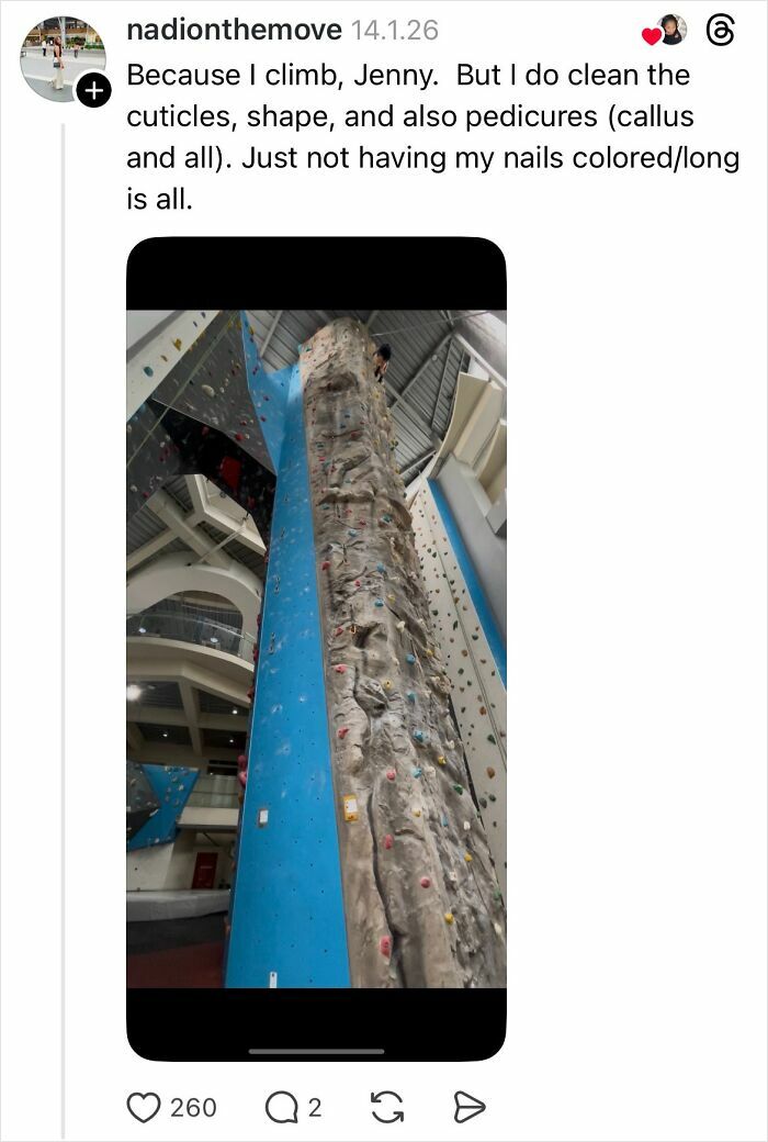 Woman climbing indoor rock wall explaining why girls don’t get their nails done with savage replies.