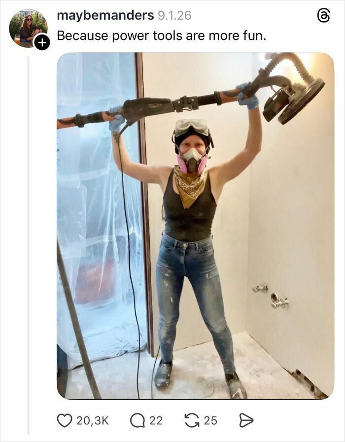 Woman holding power sanding tool wearing protective gear in a room under construction with nails reply theme