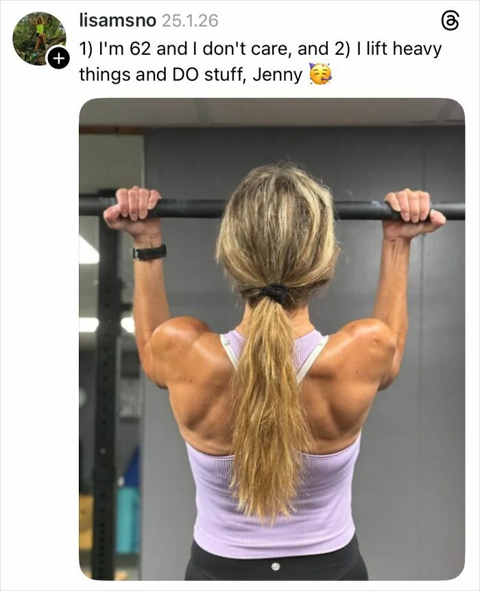 Woman lifting weights in gym showing strong back muscles and natural nails without polish or manicure.