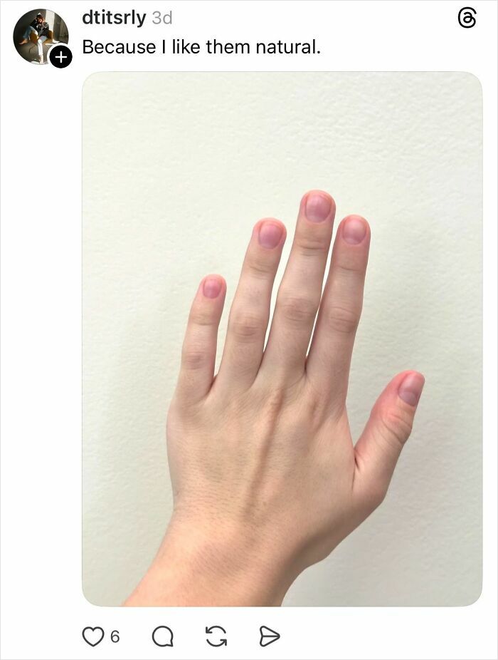 Hand showing natural nails with no polish, responding to why some girls don’t get their nails done.