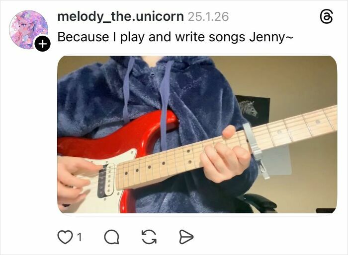 Person playing a red electric guitar, wearing a blue hoodie, related to a conversation about why girls don’t get their nails done.