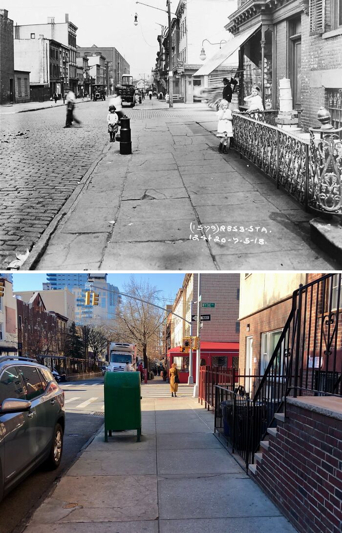 Historic black and white photo of a New York street scene showing early 20th century daily life and architecture.