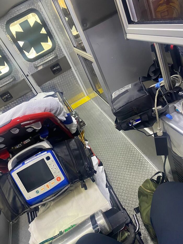 Interior of an ambulance with medical equipment, stretcher, and supplies, illustrating urgency rather than nails or savage replies.