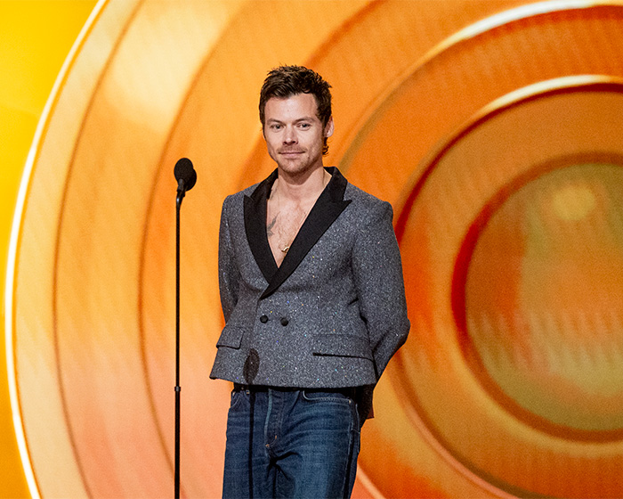 Harry Styles on stage at the 2026 Grammys wearing a gray blazer and jeans, sparking outfit criticism. Harry Styles on stage at the 2026 Grammys wearing a gray blazer and jeans, sparking outfit criticism.