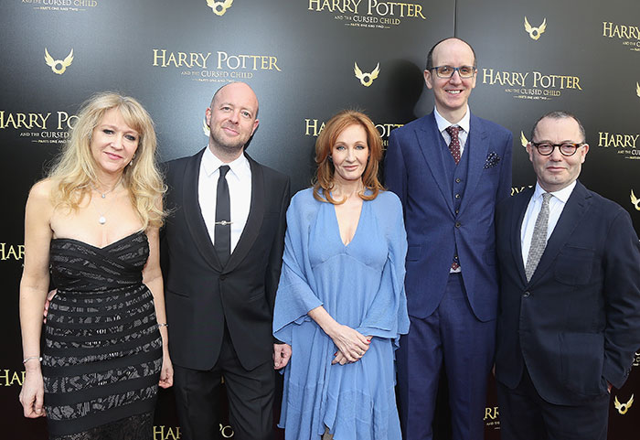 J.K. Rowling posing with colleagues at a Harry Potter event, relating to Jeffrey Epstein accusations discussion. J.K. Rowling posing with colleagues at a Harry Potter event, relating to Jeffrey Epstein accusations discussion.