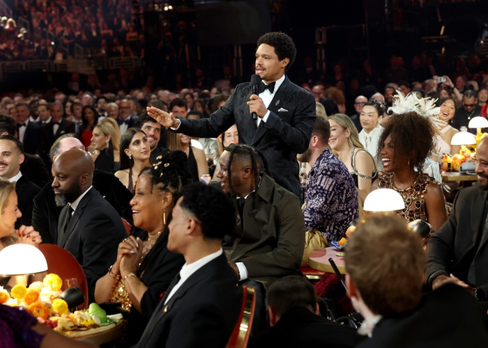 Trevor Noah speaking at the Grammys, sparking wild theories with his bizarre statement during the awards event.