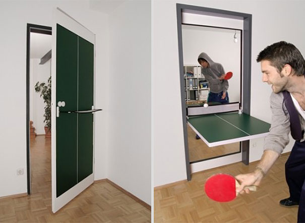 Foldable indoor ping pong table mounted on a door, showcasing creative design ideas for making your house awesome. Foldable indoor ping pong table mounted on a door, showcasing creative design ideas for making your house awesome.