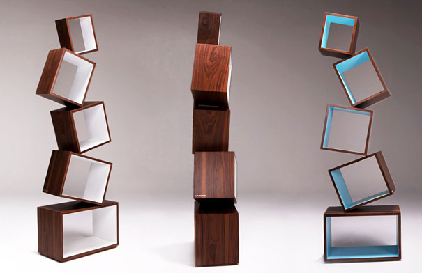 Creative bookshelf designs featuring stacked, leaning wooden cubes.