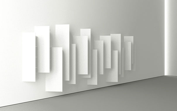 Creative bookshelf design with layered, abstract white panels on a wall. Creative bookshelf design with layered, abstract white panels on a wall.