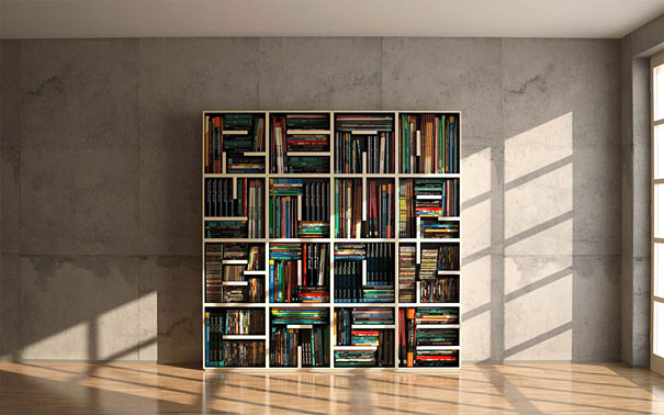 Creative bookshelf design with varied compartments filled with colorful books against a concrete wall. Creative bookshelf design with varied compartments filled with colorful books against a concrete wall.