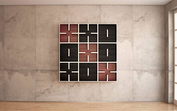 Creative bookshelf design featuring a grid pattern on a concrete wall.