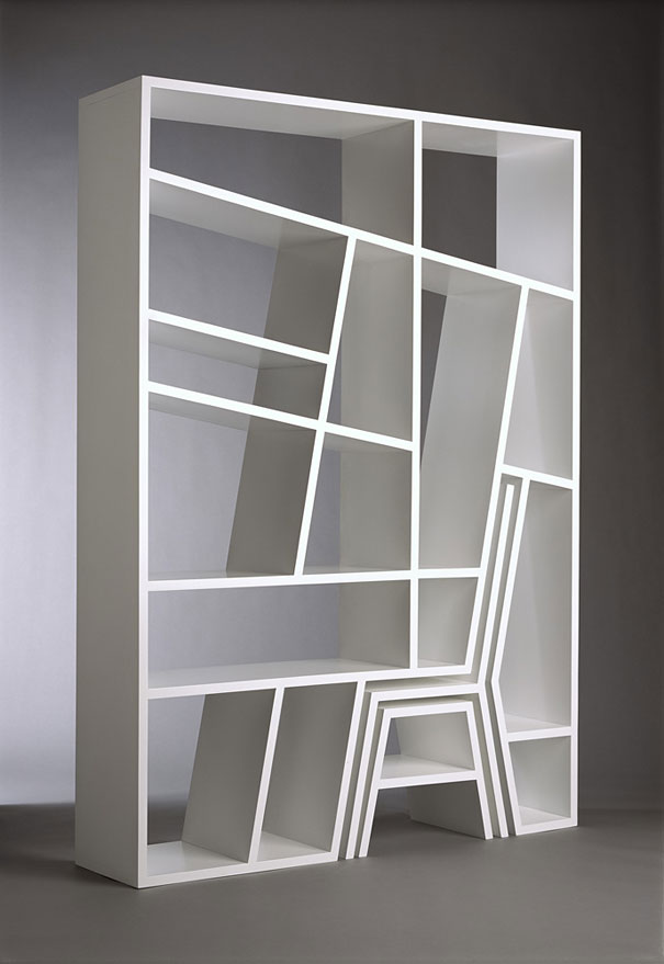 Creative bookshelf design with asymmetrical shelves and modern white framework. Creative bookshelf design with asymmetrical shelves and modern white framework.