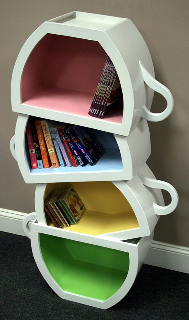 Creative bookshelf shaped like stacked cups, with colorful interior shelves holding various books. Creative bookshelf shaped like stacked cups, with colorful interior shelves holding various books.