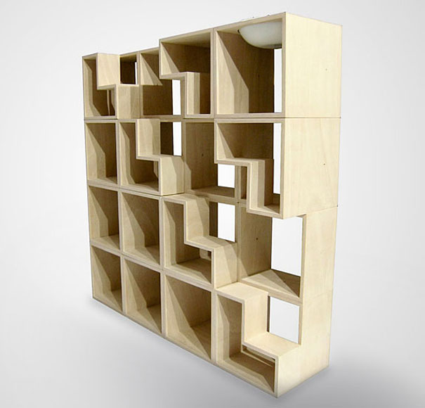 Creative bookshelf design with a unique, geometric pattern of wooden cubes in light wood. Creative bookshelf design with a unique, geometric pattern of wooden cubes in light wood.