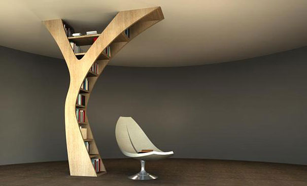 Creative bookshelf design resembling a tree, with a modern chair underneath. Creative bookshelf design resembling a tree, with a modern chair underneath.