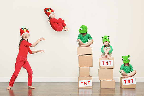 Creative dad takes crazy photos of daughters dressed in colorful costumes with playful expressions and poses.