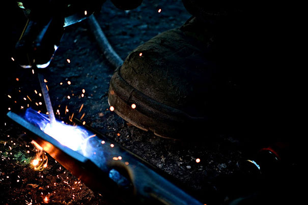 Man welds metal