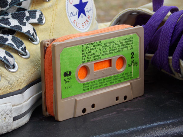 Small orange purse made from old cassette tape near yellow shoes Small orange purse made from old cassette tape near yellow shoes