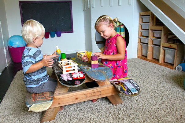 Kids playing on table made from skateboards Kids playing on table made from skateboards