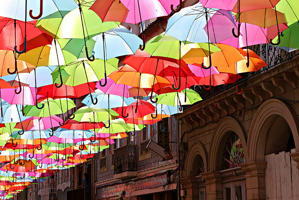 Hundreds of Floating Umbrellas Above a Street in Agueda, Portugal