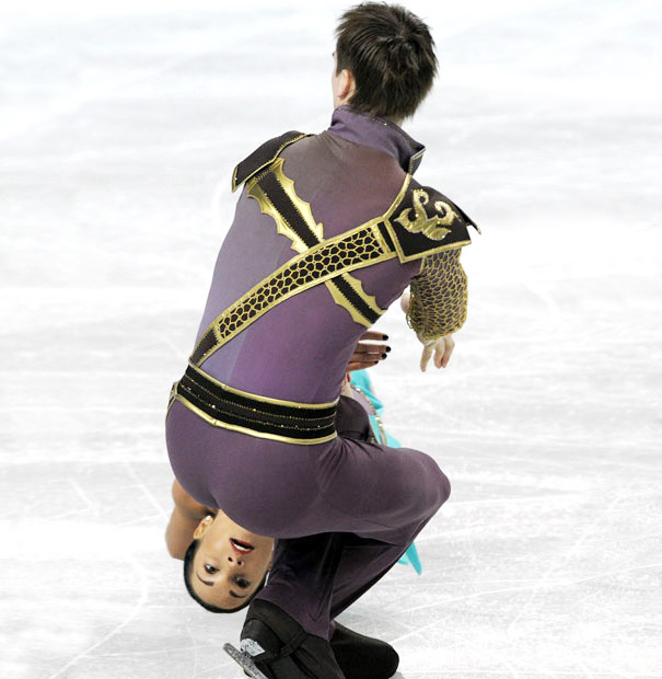 Ice skaters capture a perfectly timed moment during a performance on the rink. Ice skaters capture a perfectly timed moment during a performance on the rink.
