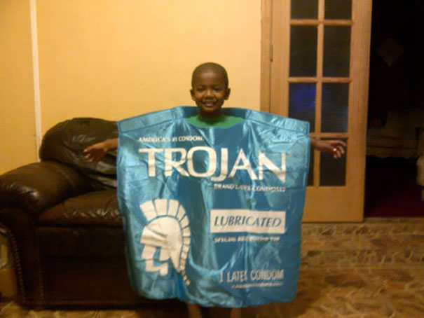 Child in a humorous Halloween costume resembling a large blue condom wrapper. Child in a humorous Halloween costume resembling a large blue condom wrapper.