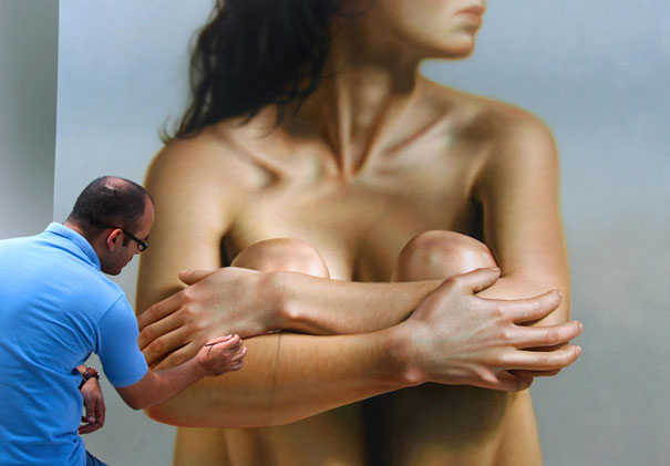Artist painting a hyper-realistic artwork of a woman, showcasing intricate details that resemble a photo. Artist painting a hyper-realistic artwork of a woman, showcasing intricate details that resemble a photo.
