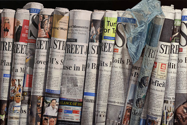 Hyper-realistic artwork of rolled newspapers, capturing fine details that make it hard to believe it's not a photo. Hyper-realistic artwork of rolled newspapers, capturing fine details that make it hard to believe it's not a photo.