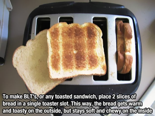 Three slices of white bread in a toaster Three slices of white bread in a toaster
