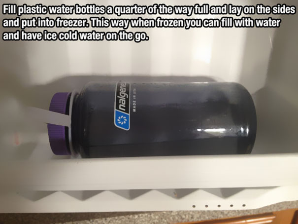 Halfway filled bottle with water laying on the side in a freezer Halfway filled bottle with water laying on the side in a freezer