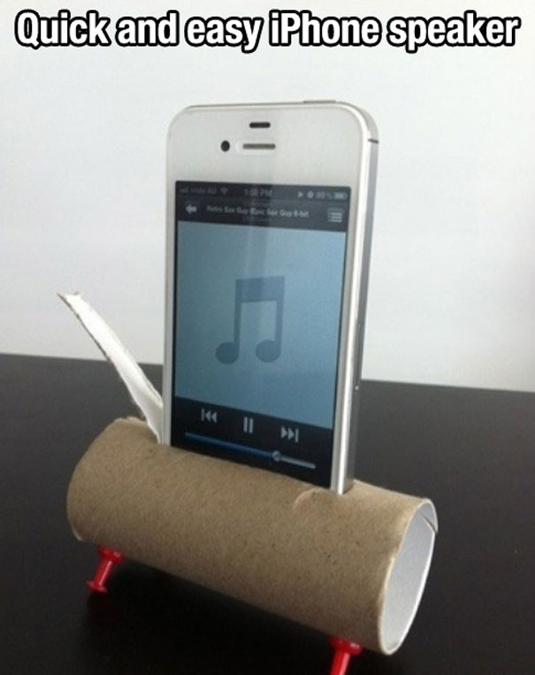 Toilet roll used as an iPhone stand to listen to music Toilet roll used as an iPhone stand to listen to music