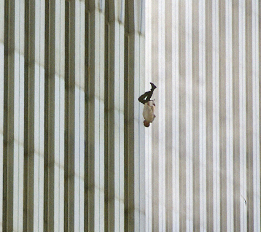 A powerful image of a person falling from a building with striped exterior. A powerful image of a person falling from a building with striped exterior.