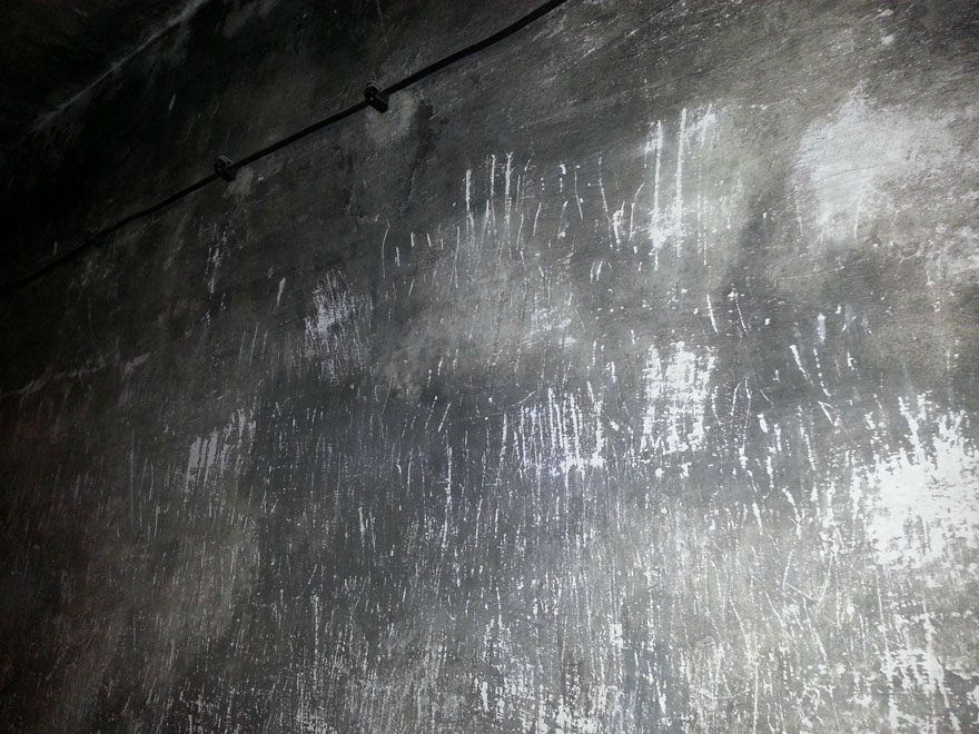 Scratched gray wall surface evoking powerful emotions and haunting memories. Scratched gray wall surface evoking powerful emotions and haunting memories.