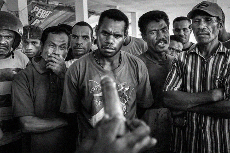 A group of men in intense focus, displaying emotions in a powerful, compelling moment. A group of men in intense focus, displaying emotions in a powerful, compelling moment.