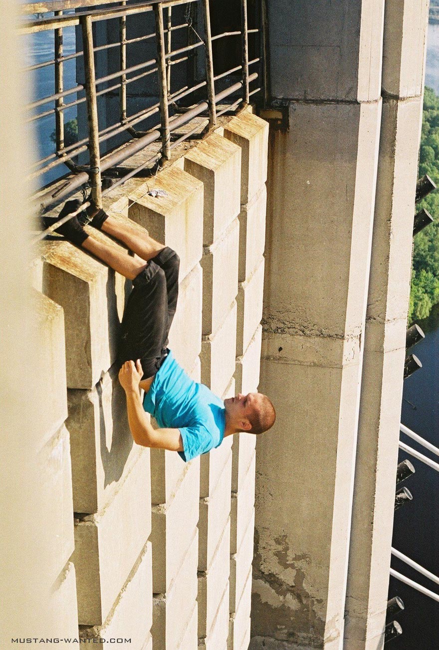 Dizzying Photos of Ukrainian Daredevil Hanging from Tall Buildings