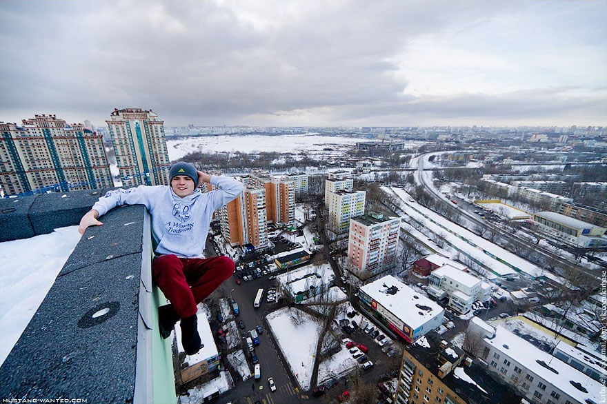 Dizzying Photos of Ukrainian Daredevil Hanging from Tall Buildings Dizzying Photos of Ukrainian Daredevil Hanging from Tall Buildings
