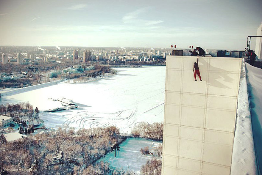 Dizzying Photos of Ukrainian Daredevil Hanging from Tall Buildings Dizzying Photos of Ukrainian Daredevil Hanging from Tall Buildings