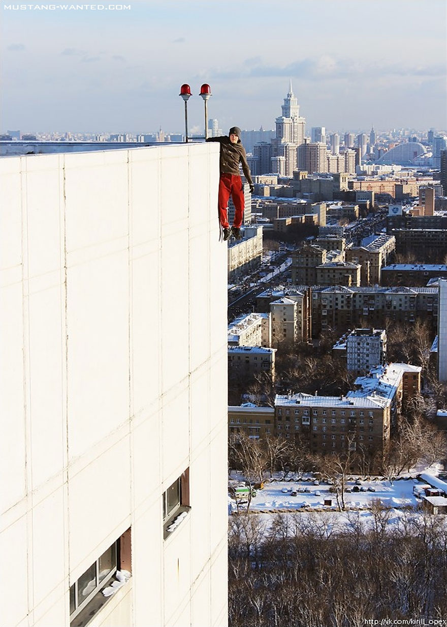 Dizzying Photos of Ukrainian Daredevil Hanging from Tall Buildings