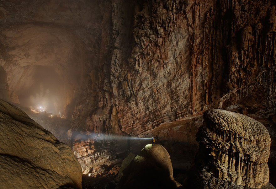 Unbelievable cave destination with a person exploring with a flashlight. Unbelievable cave destination with a person exploring with a flashlight.