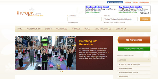 Website homepage screenshot for therapist directory featuring a yoga class image.